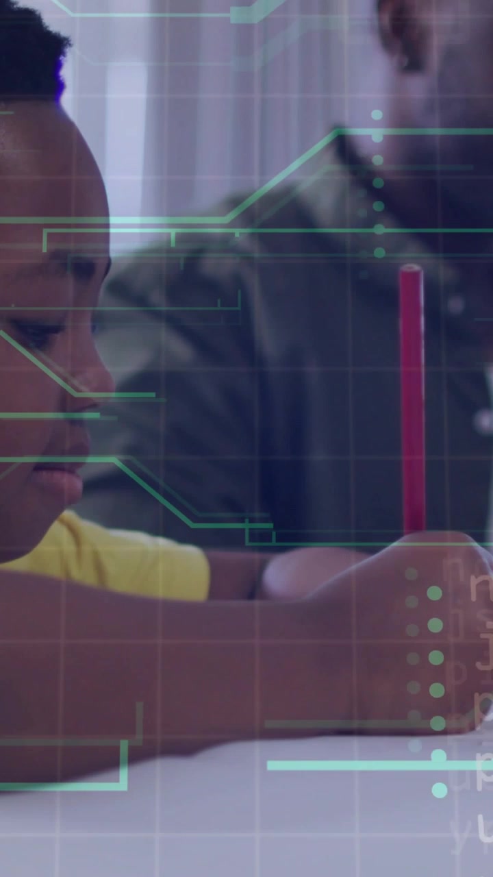 Vertical video: Boy lifting red pencil and drawing on desk, HUD overlay tracing pencil for learning
