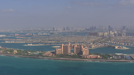 aerial establishing shot of hotel atlantis, on the famous palmtree in dubai, uae