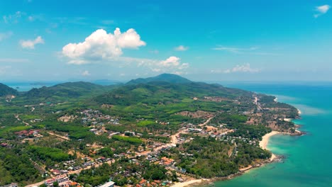 4K-Cinematic-nature-drone-footage-of-a-panoramic-aerial-view-of-the-beautiful-beaches-and-mountains-on-the-island-of-Koh-Lanta-in-Krabi,-South-Thailand,on-a-sunny-day