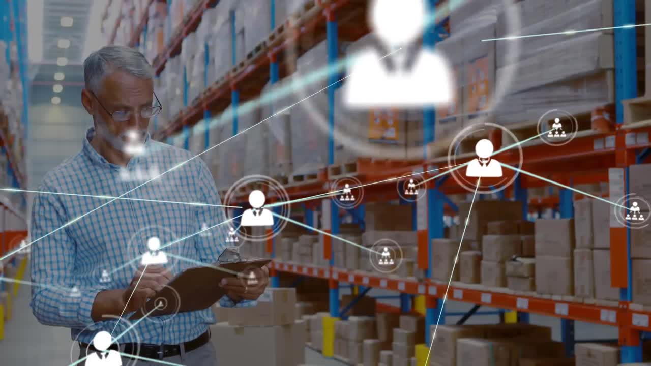 Animation of network of profile icons over caucasian male supervisor checking stock at warehouse
