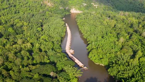 floating river kwai hotels surrounded by jungle in kanchanaburi, at golden hour