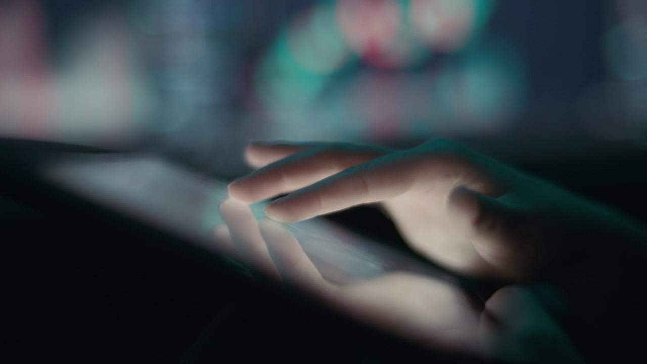 Stock broker exploring stock market graph on a tablet touchscreen