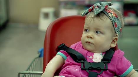 child sits in a specially equipped chair 4 in a trolley