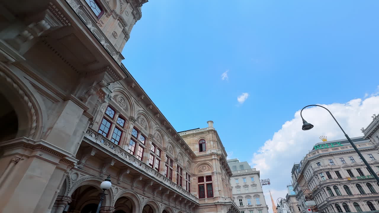 Vienna, Austria - June 9, 2025: Tourists in sunny Vienna. Visitors stroll through beautiful streets of Wien, admiring historic architecture under a clear blue sky