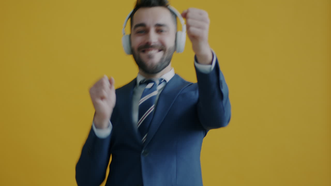 Businessman Dancing with Headphones