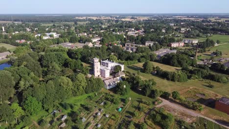 Vecauce-Manor-in-Latvia-Aerial-View-of-the-Pink-Castle-Through-the-Park