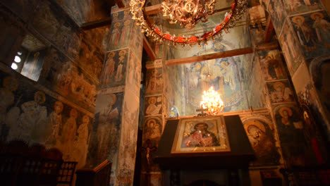 church interior with frescoes and a jesus painting