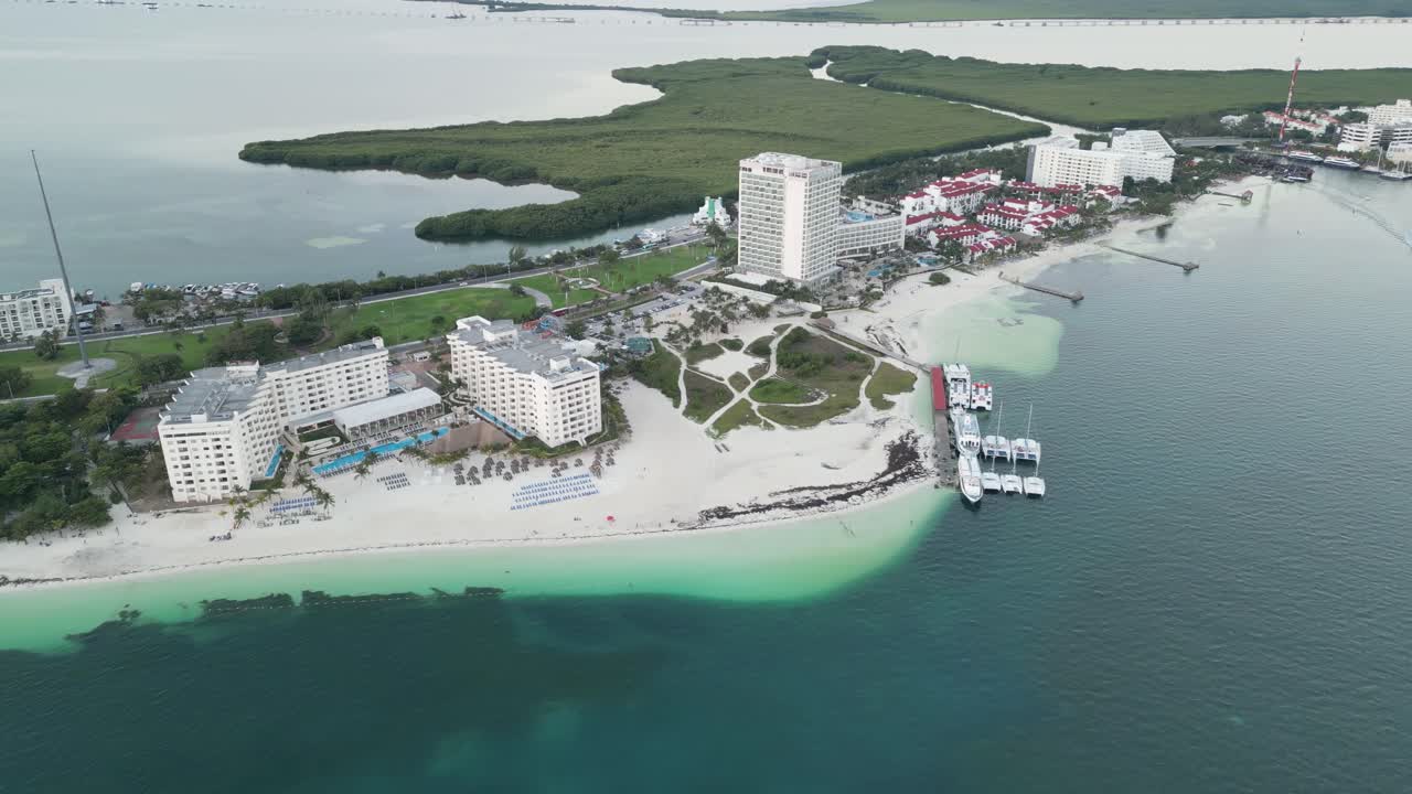 Cancun's hotel zone at playa langosta with turquoise waters and resorts, aerial view