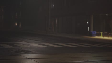 land vehicles driving on the street at night