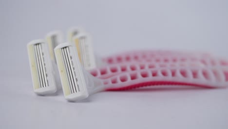 close up of pink  razor on table