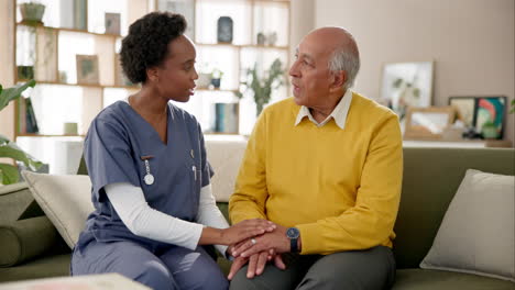 nurse assisting elderly man at home