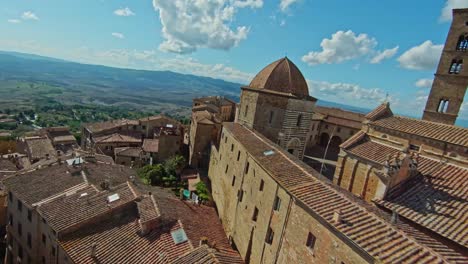 fast aerial over the walled town of volterra, province of pisa, italy