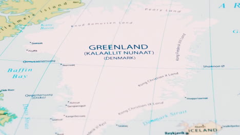 close-up of the country word greenland on a world map with the detailed name of the capital city