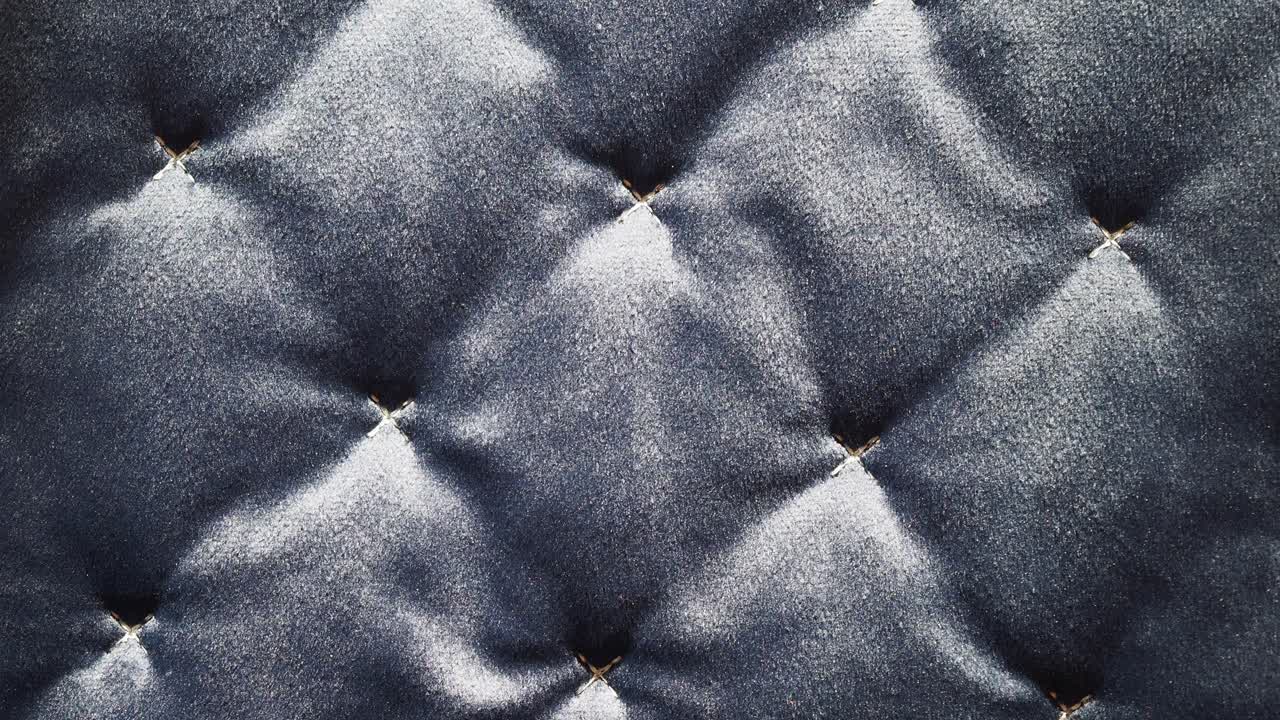 textura de tela acolchada de color gris oscuro