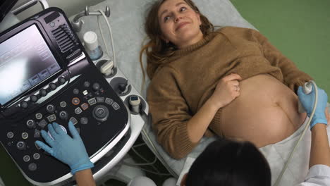 pregnant woman laying on stretcher