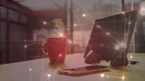 animation of network of connections over cup of coffee and tablet