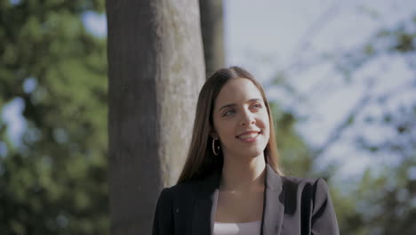 happy young woman resting in park