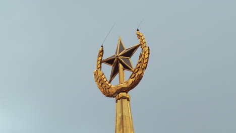 gold star emblem on a building