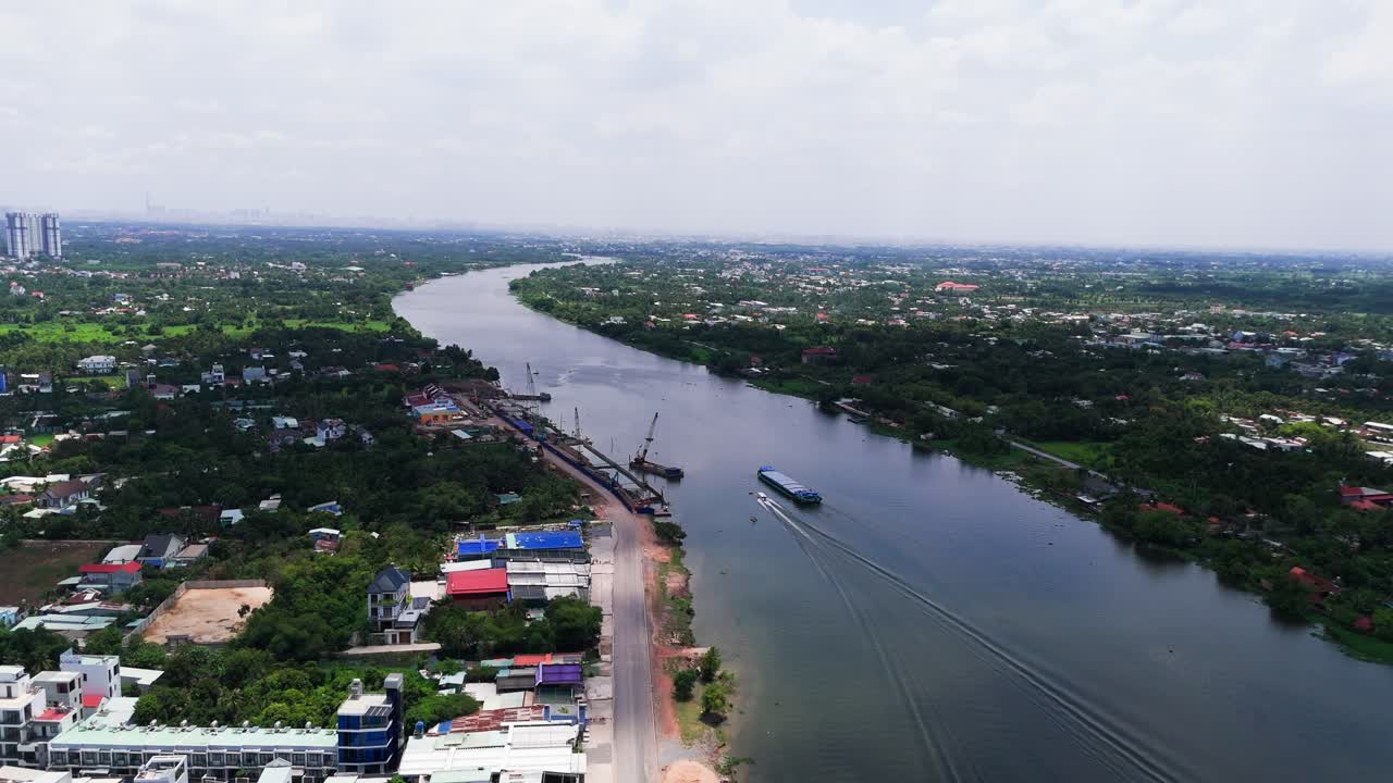 Aerial View of the Speedboat Passing a Ship in the River.