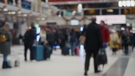blurred footage of unrecognizable people passing by on the station