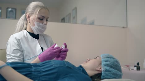 master shows cosmetic product to client in beauty salon