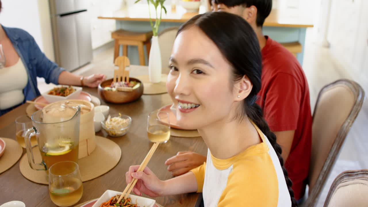 Eating together, family enjoying meal and conversation at dining table