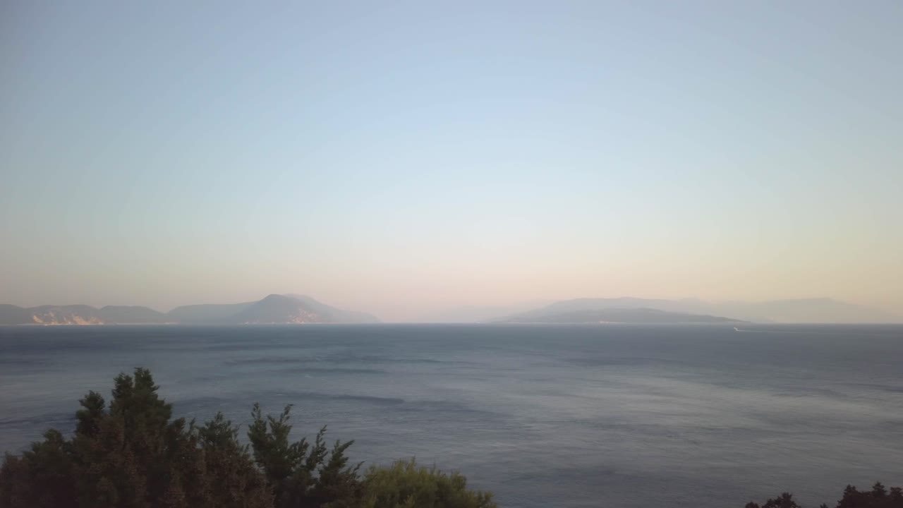Ithaki and Kefalonia as seen from Leukada in the early evening, panning
