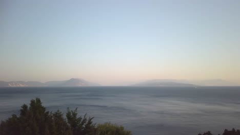 ithaki and kefalonia as seen from leukada in the early evening, panning