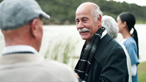 group of senior men having a conversation outdoors