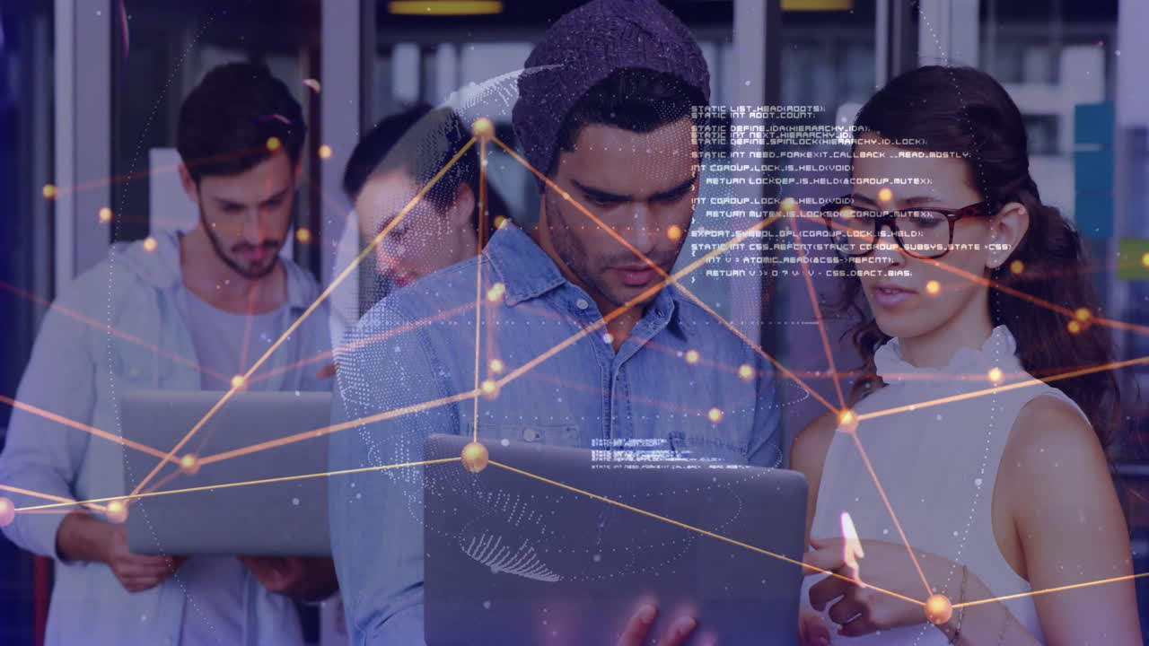 Young professionals collaborating on laptops with digital network overlay animation