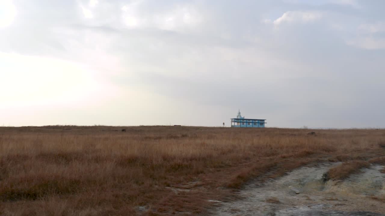 yellow grass mountain flat with misty flat sky at morning
