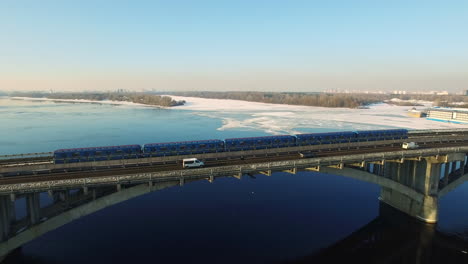 aerial view of subway train riding on bridge railway