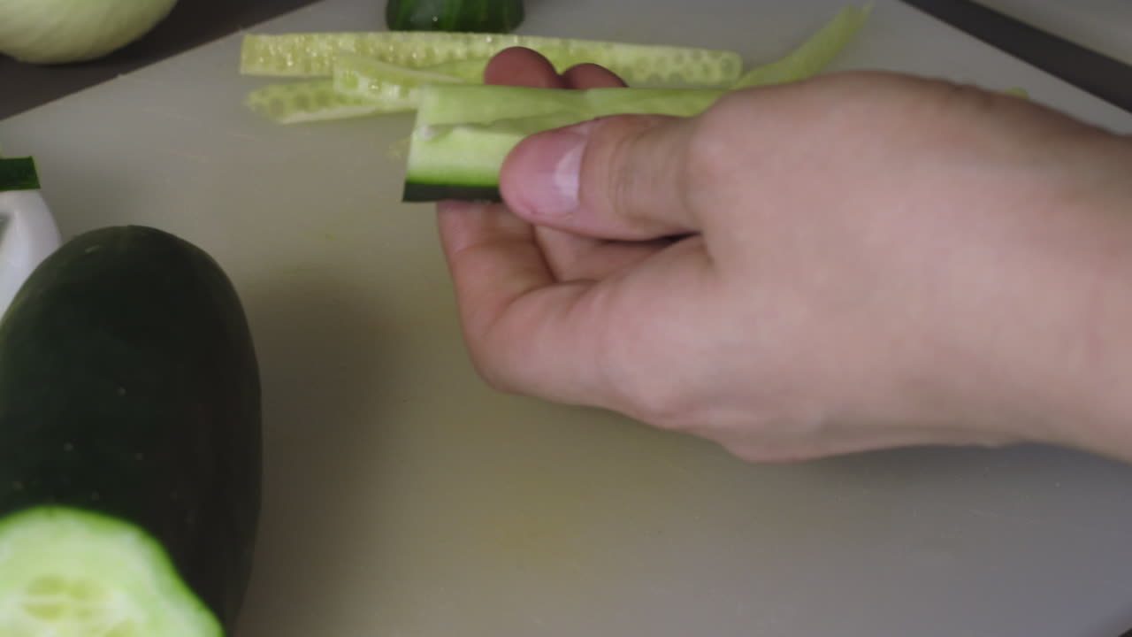 Removing the seeds off a cucumber - Making a delicious salad - Close up