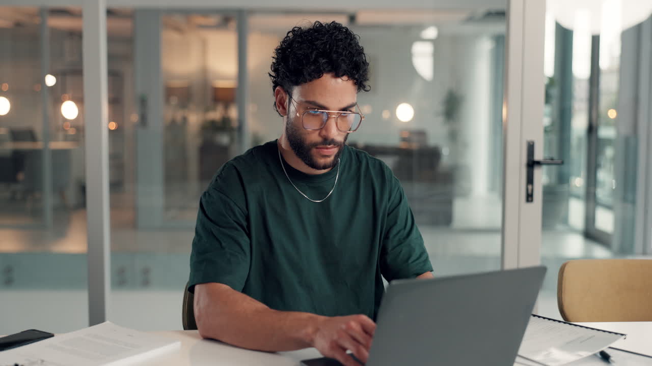 Man working on laptop in office