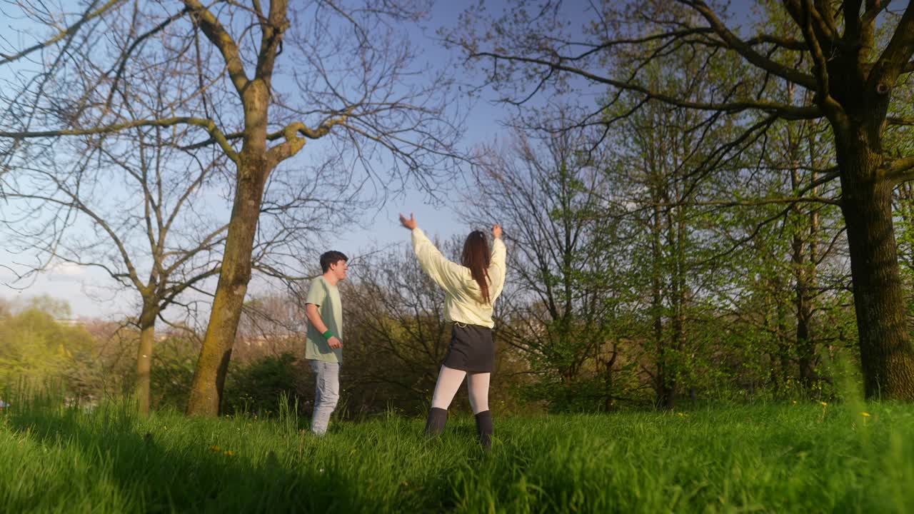 Two people interacting in a park