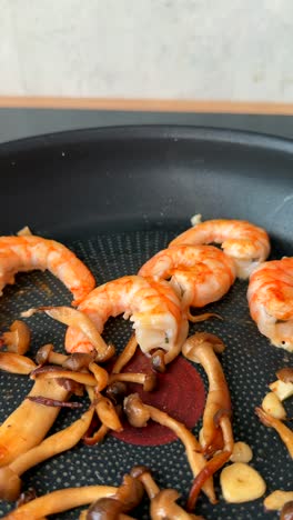 shrimp and mushrooms in pan