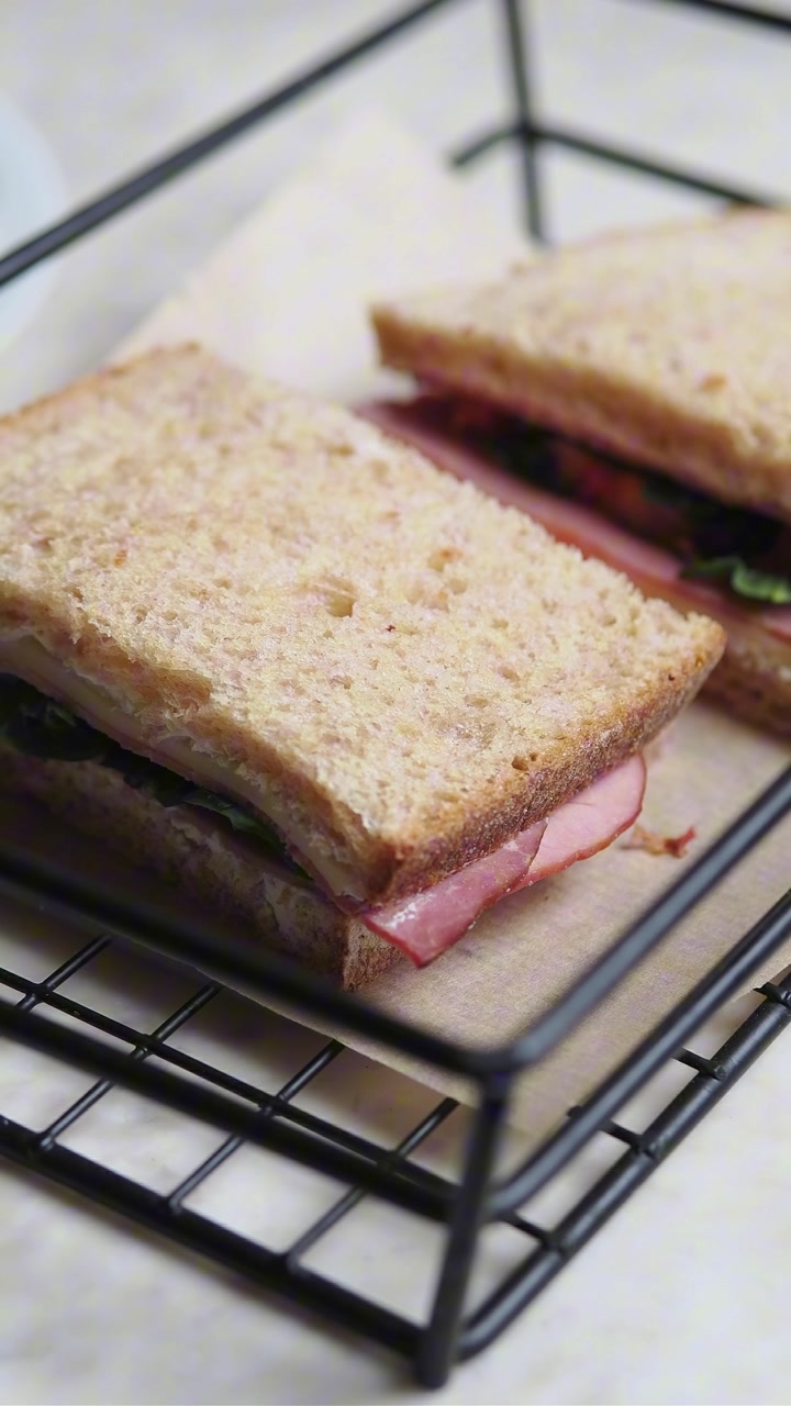 Close-up of a Fresh Ham and Cheese Sandwich in a Wire Basket