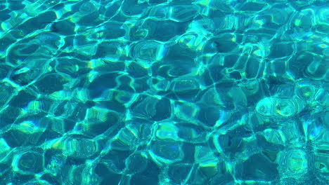 bright rippled very blue sea water reflecting sun