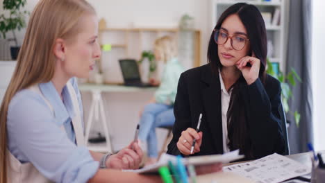 Female-Employees-Discuss-Project-and-Sales-Strategy