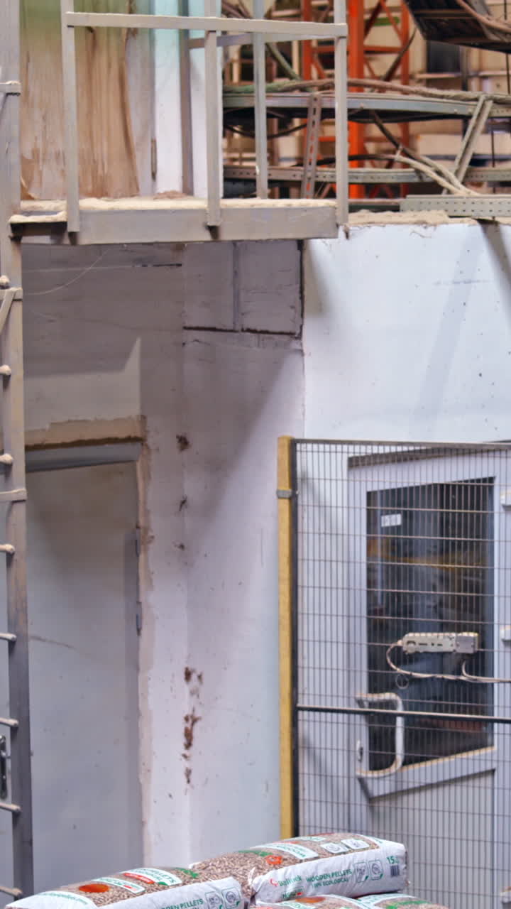 Processing of timber at the sawmill. Sawing boards from logs with modern sawmill. Vertical video
