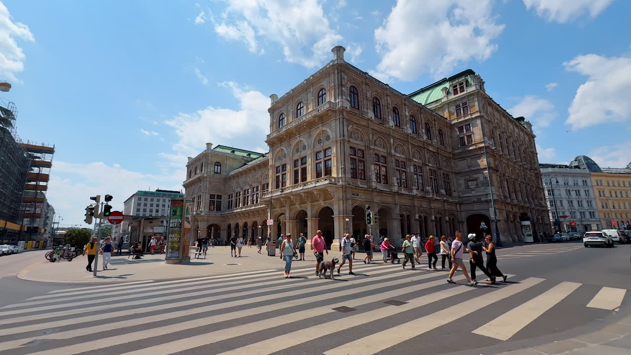 Vienna, Austria - June 9, 2025: Amazing architectural design of the Vienna State Opera building. Low angle view on the stunning old building from across the street