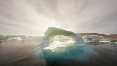 iceberg archway with sunset