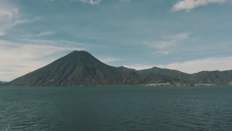 drone aerial landscape view of volcanoes and lake atitlan in guatemala