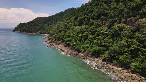 drone dolly shot of tropical island coastline in koh chang, thailand