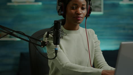 Portrait-of-african-smiling-blogger-looking-at-camera