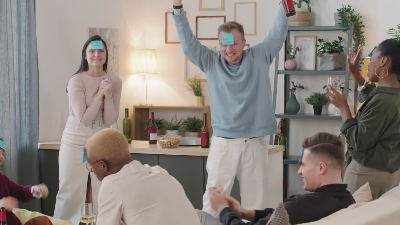 Man Winning Guessing Game at House Party