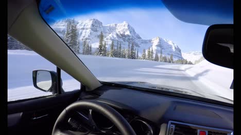 Car-driving-on-snowy-road-4k