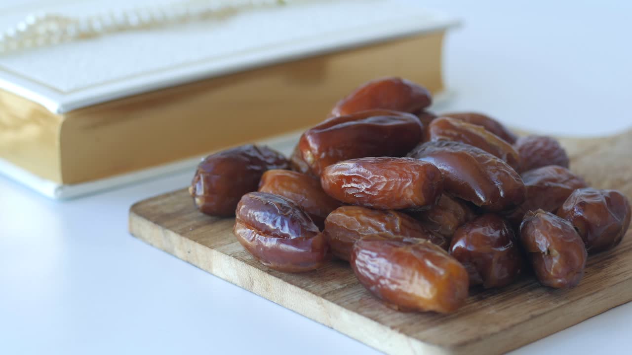 Dates on a wooden board with a book