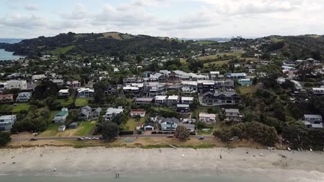 aerial view of the beach and bay full of boats at waiheke, new zealand