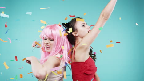 two women celebrating with confetti